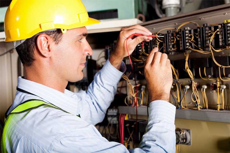 Electrician wearing a yellow safety cap